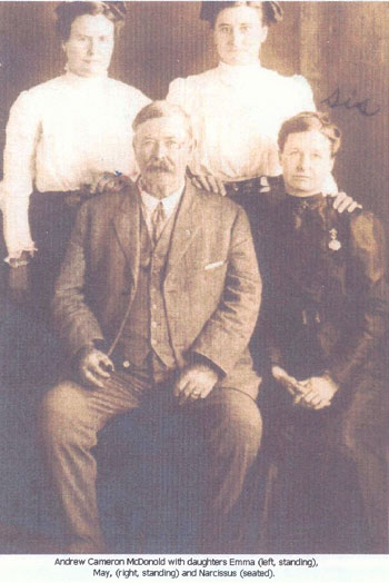 Picture of Andrew Cameron McDonold with daughters Emma, May and Narcissus