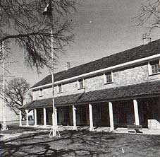 Photo of the headquarters building which contains a military museum. Taken by Charles M. Robinson, III from the book, Frontier Forts of Texas